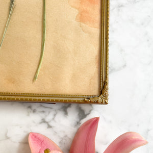 Goudkleurige vintage fotolijst met bolglas